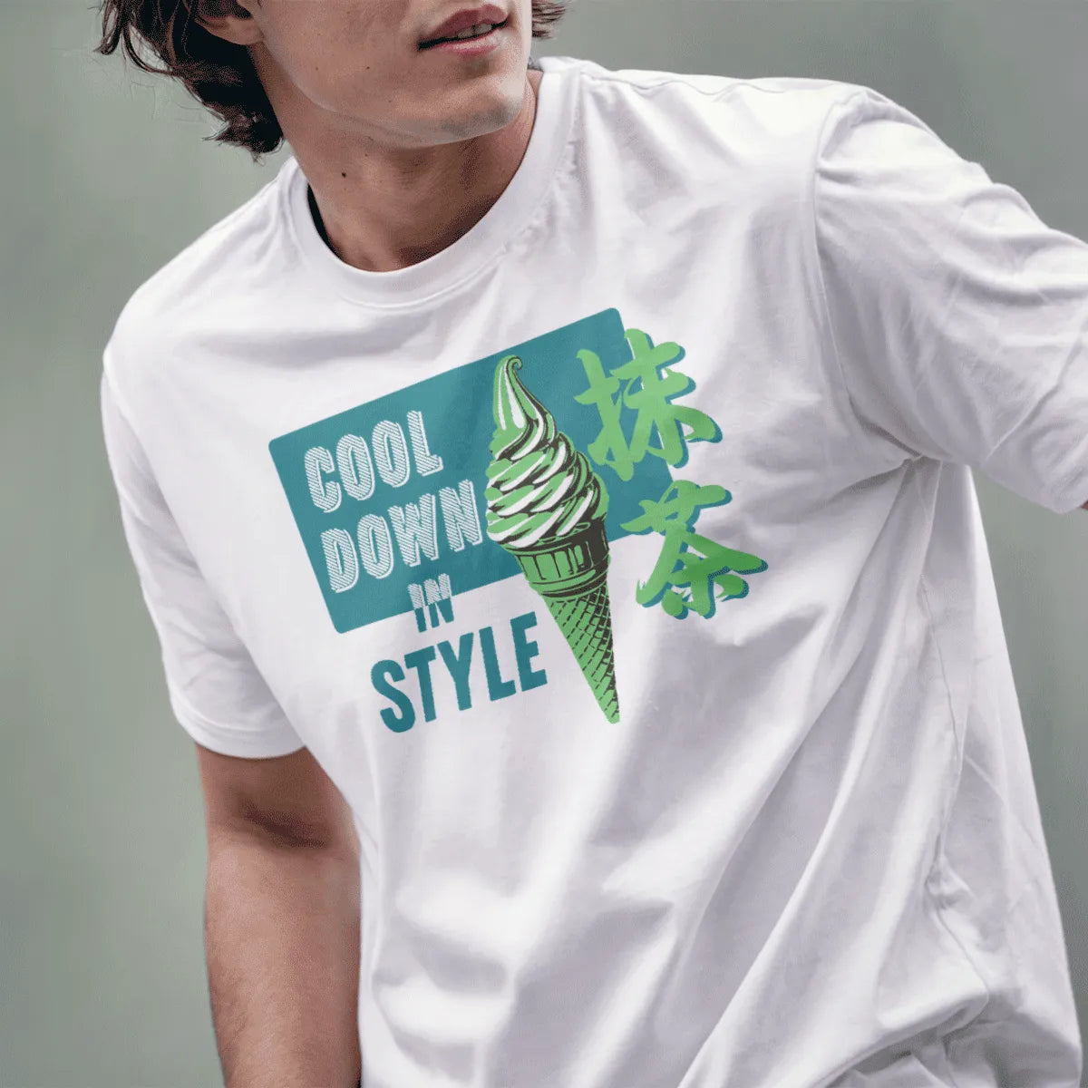 Male model wears white t-shirt with vibrant matcha ice cream art, retro text, and Japanese details.