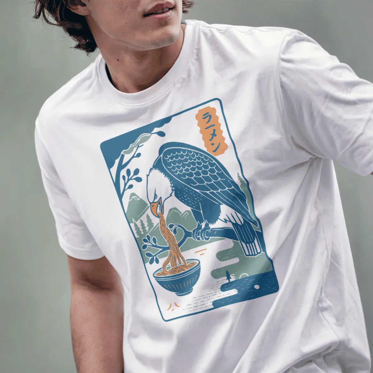 Male model in white t-shirt with eagle eating ramen, scenic background. japanese t-shirts, modern tradition