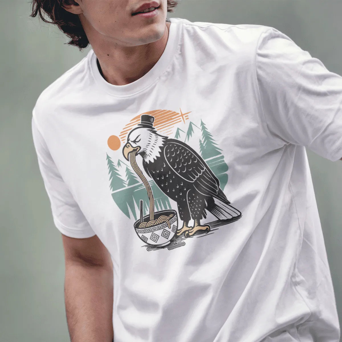 Male model in white t-shirt with eagle eating noodles, Japanese t-shirts, serene landscape.