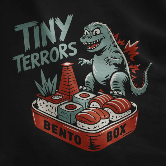 Black fabric closeup of whimsical Godzilla on sushi bento, godzilla shirt, traditional Japanese art.
