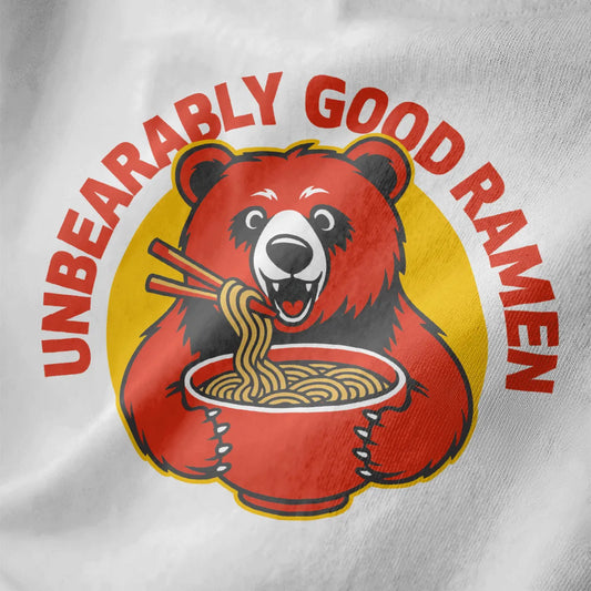 Close-up of playful red bear eating ramen on white shirt, bold typography, ramen t-shirt, vibrant style.