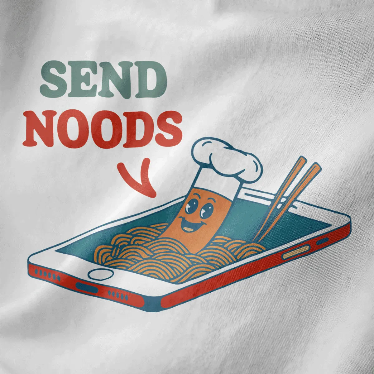Close-up of playful “SEND NOODS” ramen t-shirt design on white fabric, featuring animated noodle and chopsticks.