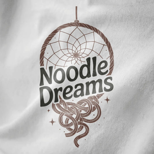 Close-up of white fabric featuring circular dreamcatcher with flowing ramen noodles and sparkling stars.