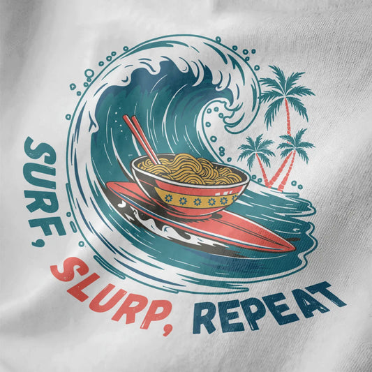Close-up of white t-shirt fabric with teal ocean wave, red surfboard, and ornate ramen bowl with chopsticks.
