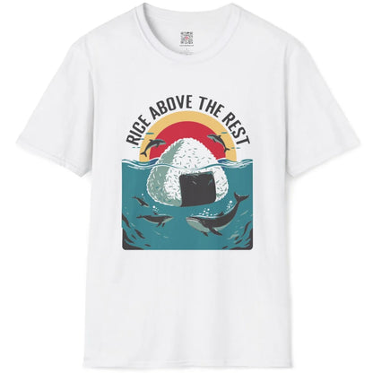 White t-shirt flatlay displaying textured onigiri, leaping dolphins, and bold curved “Rice Above the Rest” lettering.