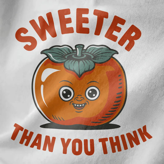 Close-up white shirt with playful persimmon face in orange and teal, retro style, bold text phrase.